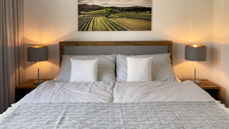 Box spring bed in bedroom 2, © Kay Haderer